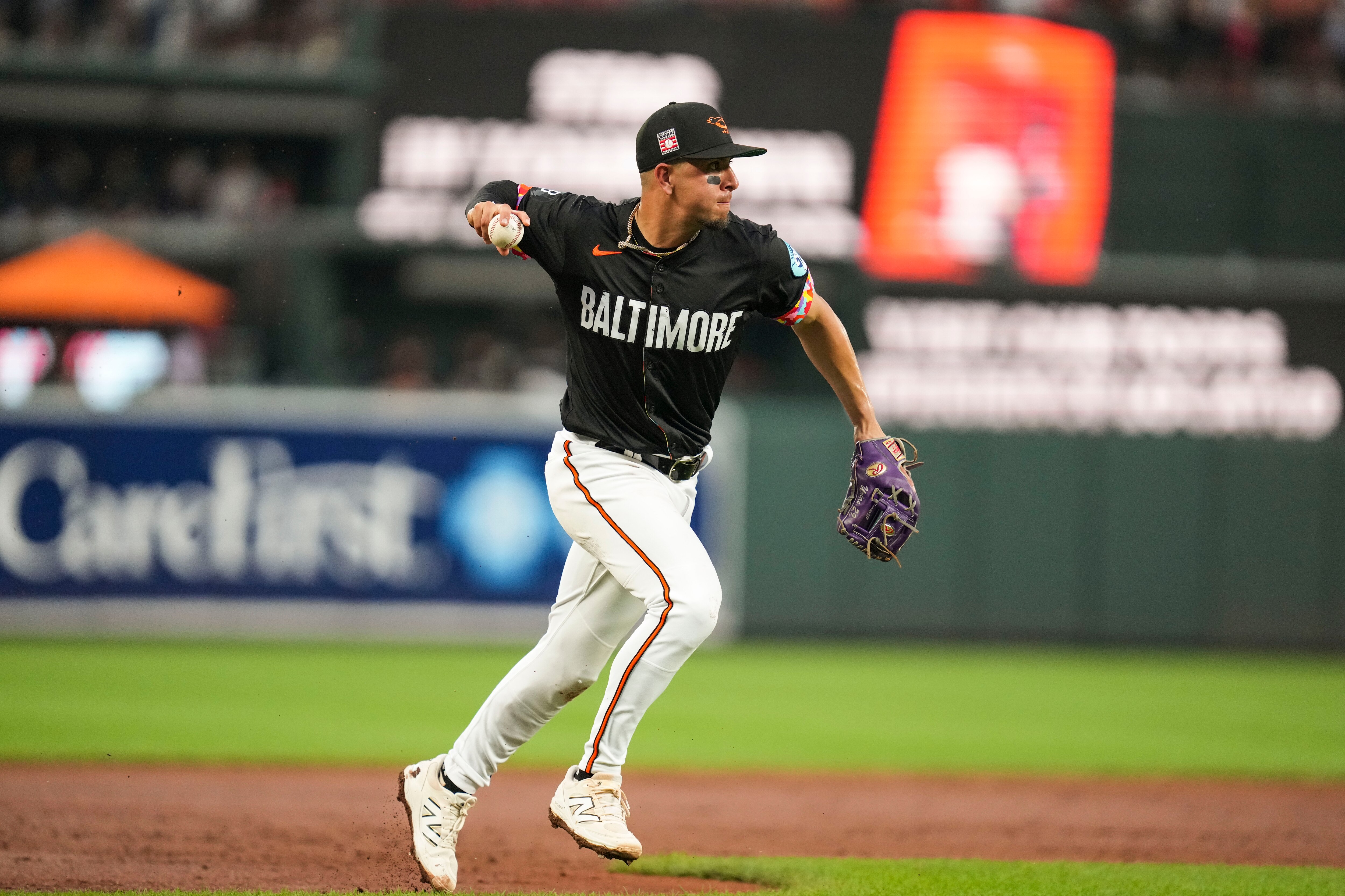 Baltimore Orioles third baseman Ramón Urías (29) throws a ball to first base during a game against the Colorado Rockies at Oriole Park at Camden Yards in Baltimore, on Friday, July 25, 2025.