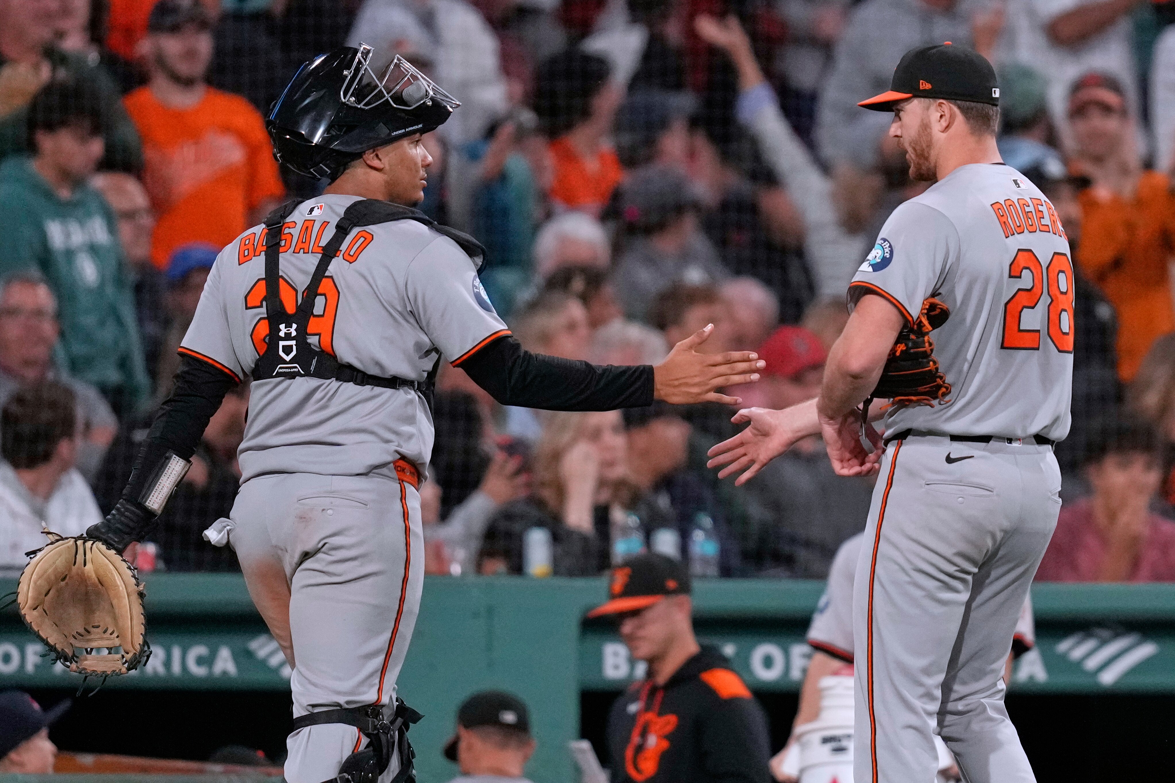 Baltimore Orioles pitcher Trevor Rogers is congratulated by catcher Samuel Basallo after completing the bottom of the seventh inning.