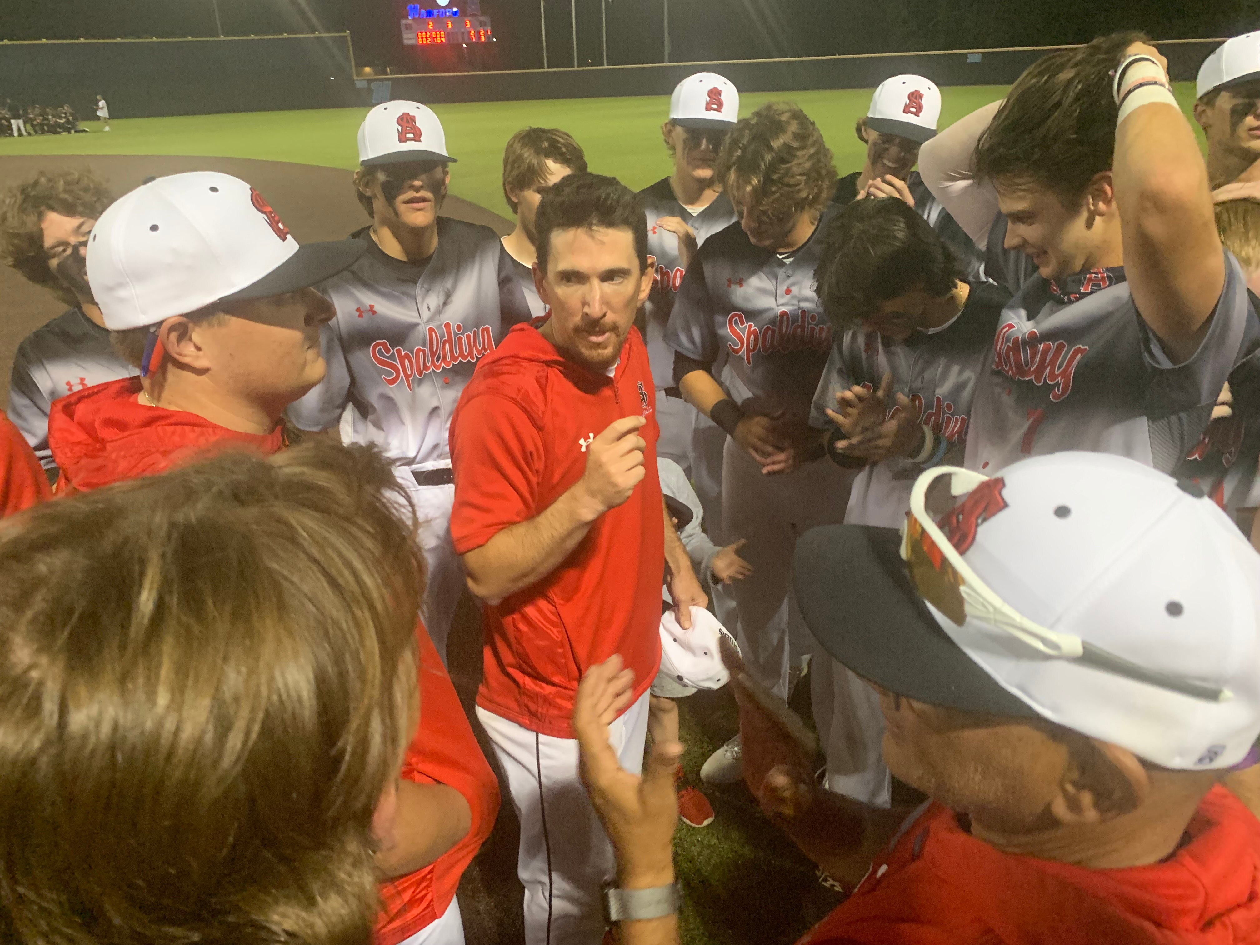 Archbishop Spalding baseball coach Joe Palumbo (center) talks to his team after the Cavaliers' latest MIAA A Conference championship last spring. The Anne Arundel County private powerhouse is the undisputed No. 1 team in the Baltimore Banner/Varsity Sports Network Preseason Top 15 poll.