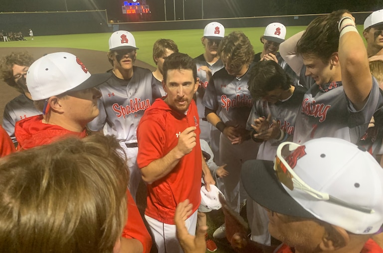 Archbishop Spalding baseball coach Joe Palumbo (center) talks to his team after the Cavaliers' latest MIAA A Conference championship last spring. The Anne Arundel County private powerhouse is the undisputed No. 1 team in the Baltimore Banner/Varsity Sports Network Preseason Top 15 poll.