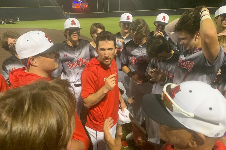 Archbishop Spalding baseball coach Joe Palumbo (center) talks to his team after the Cavaliers' latest MIAA A Conference championship last spring. The Anne Arundel County private powerhouse is the undisputed No. 1 team in the Baltimore Banner/Varsity Sports Network Preseason Top 15 poll.