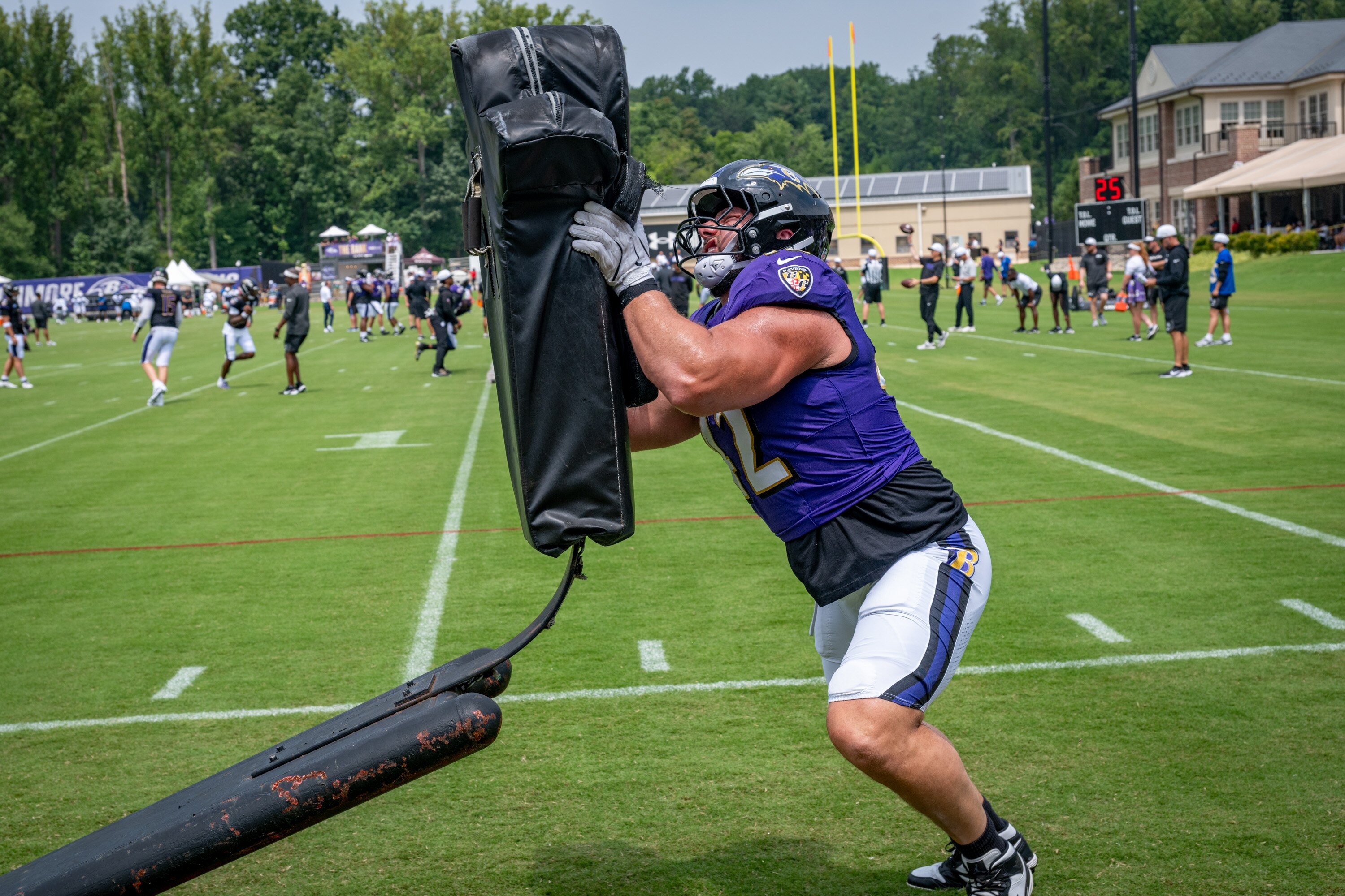 Tuesday, Aug. 5, 2025 — Ravens Patrick Ricard hits the sled during practice at Ravens Training Camp.