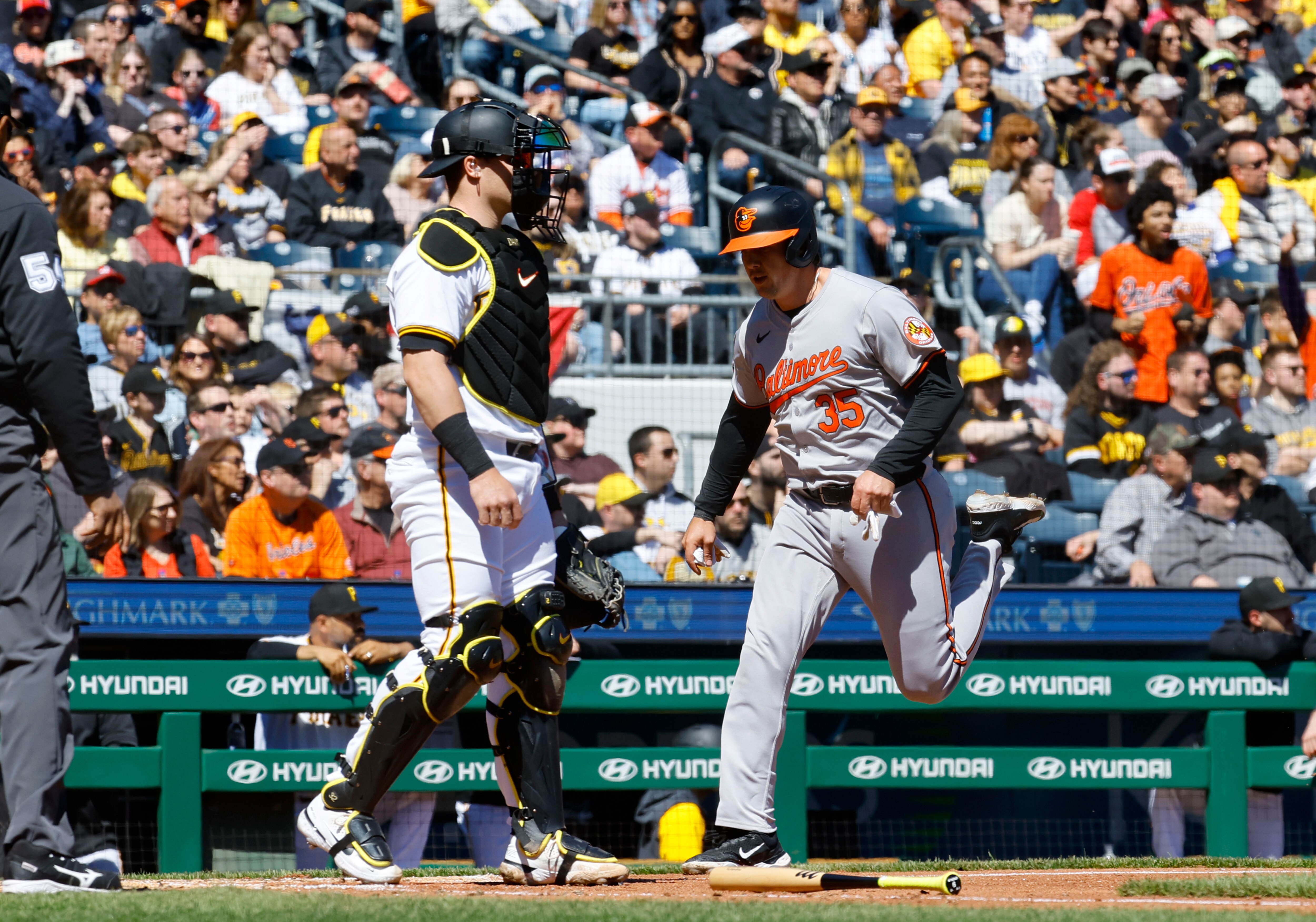 Adley Rutschman scores a fourth-inning run for the Orioles during their 3-2 loss at Pittsburgh on Saturday.