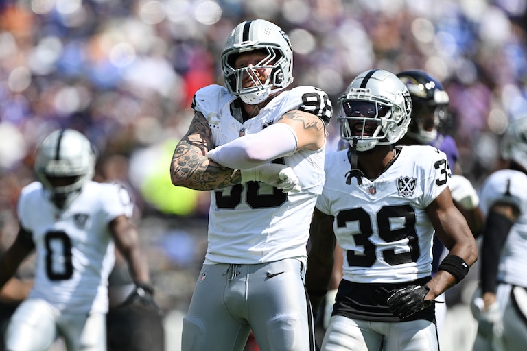Las Vegas Raiders defensive end Maxx Crosby (98) celebrates a sack of Baltimore Ravens quarterback Lamar Jackson, not pictured, with teammate cornerback Nate Hobbs (39) during the first half of an NFL football game, Sunday, Sep. 15, 2024, in Baltimore. (AP Photo/Terrance Williams)