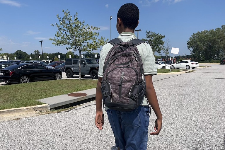 Ethan walks out of Paint Branch High School during his second week at the comprehensive campus, which is 28 times the size of his last school.