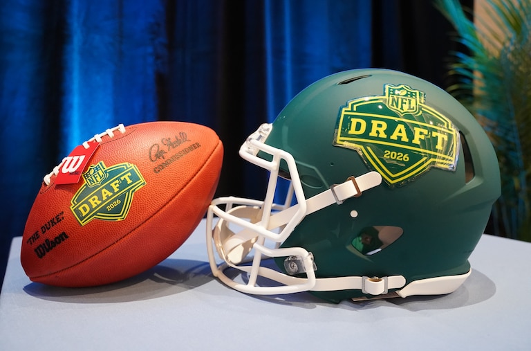 Football helmet and ball during the Prospect to Pro Family Panel event ahead of the NFL draft in Pittsburgh, Wednesday, April 22, 2026.
