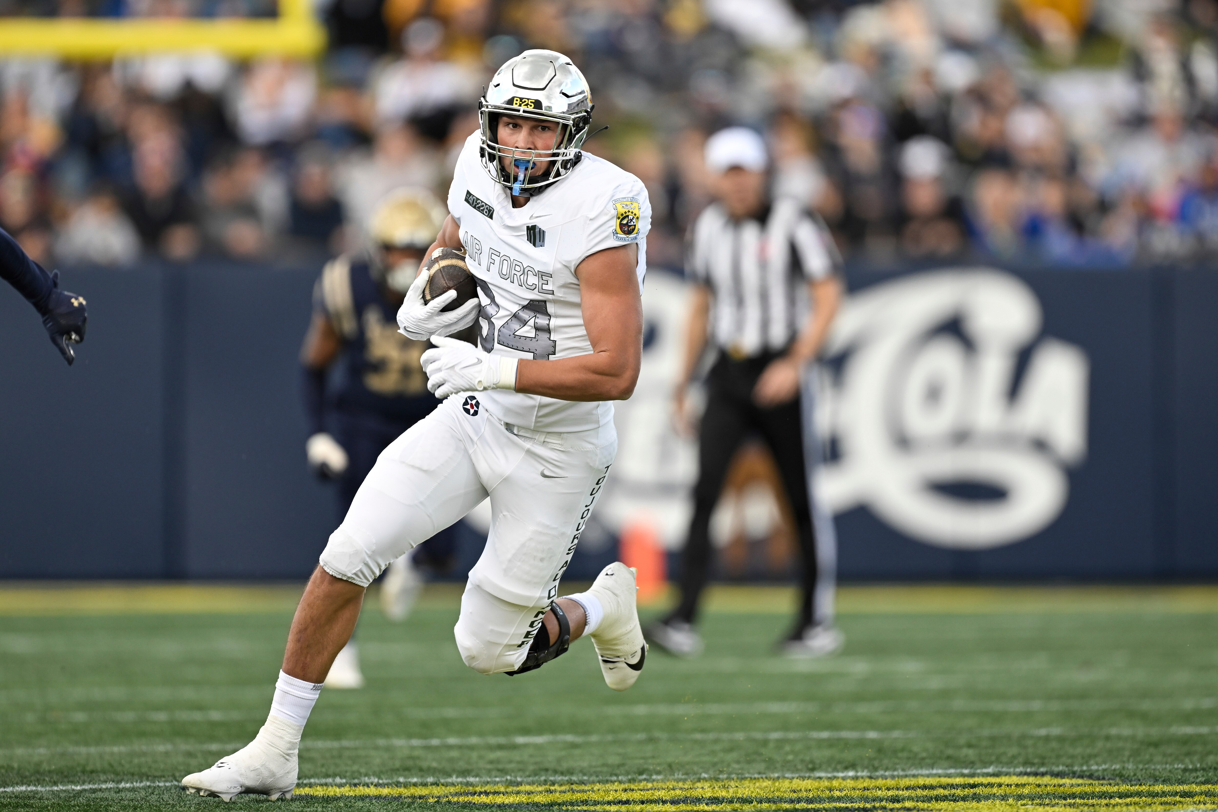 Air Force tight end Caleb Rillos runs after making a catch during the first half of the Falcons' 17-6 win at Navy on Saturday.