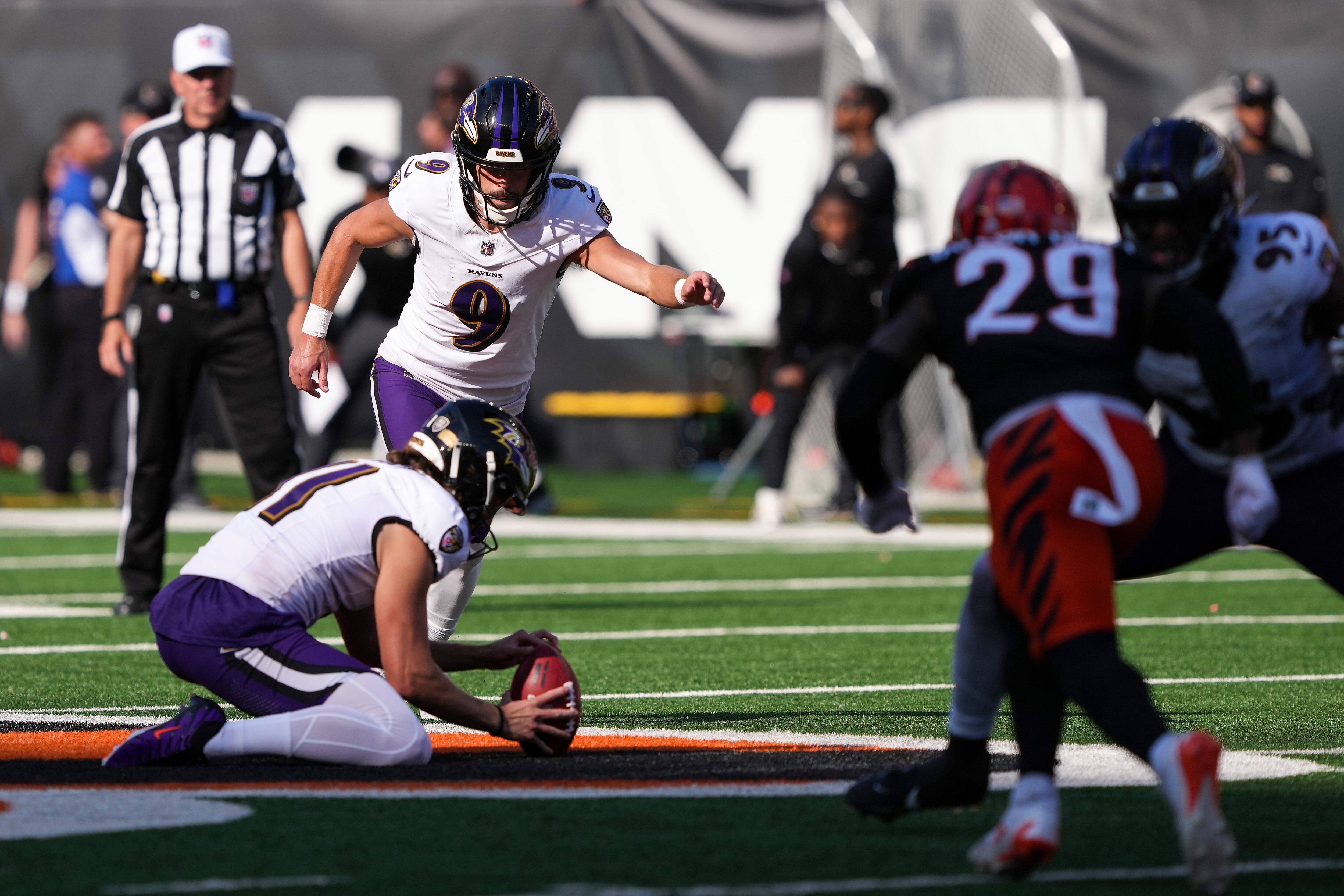 Justin Tucker kicks the game-tying field goal in the fourth quarter Sunday in Cincinnati.