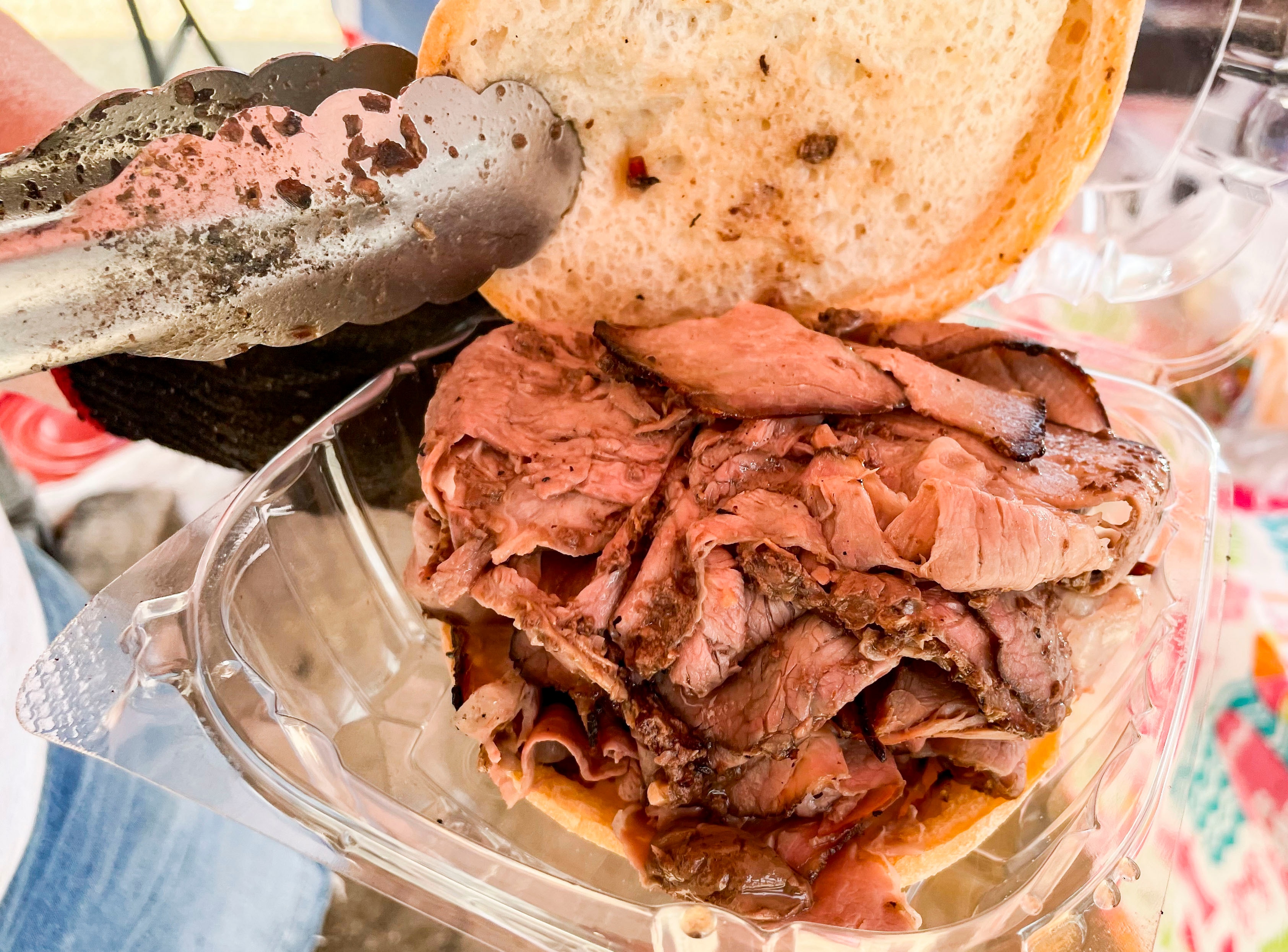 Joyce Trigger’s pit beef sandwich is flavorful and moist from the au jus she spoons on top of the sliced beef.