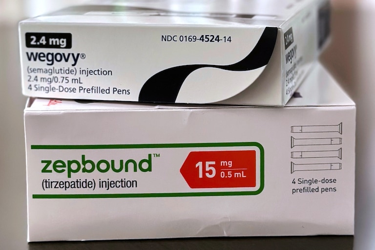 FILE - Boxes for the medications Wegovy and Zepbound are arranged for a photograph in California, May 8, 2025. (AP Photo/JoNel Aleccia, File)