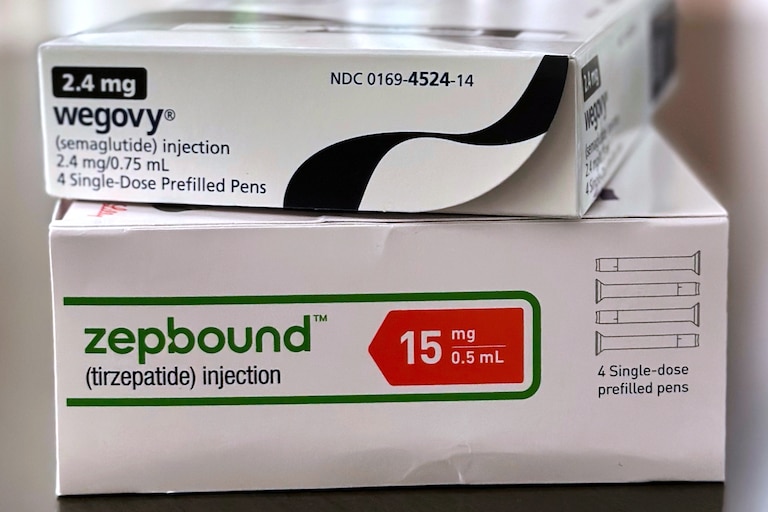 FILE - Boxes for the medications Wegovy and Zepbound are arranged for a photograph in California, May 8, 2025. (AP Photo/JoNel Aleccia, File)