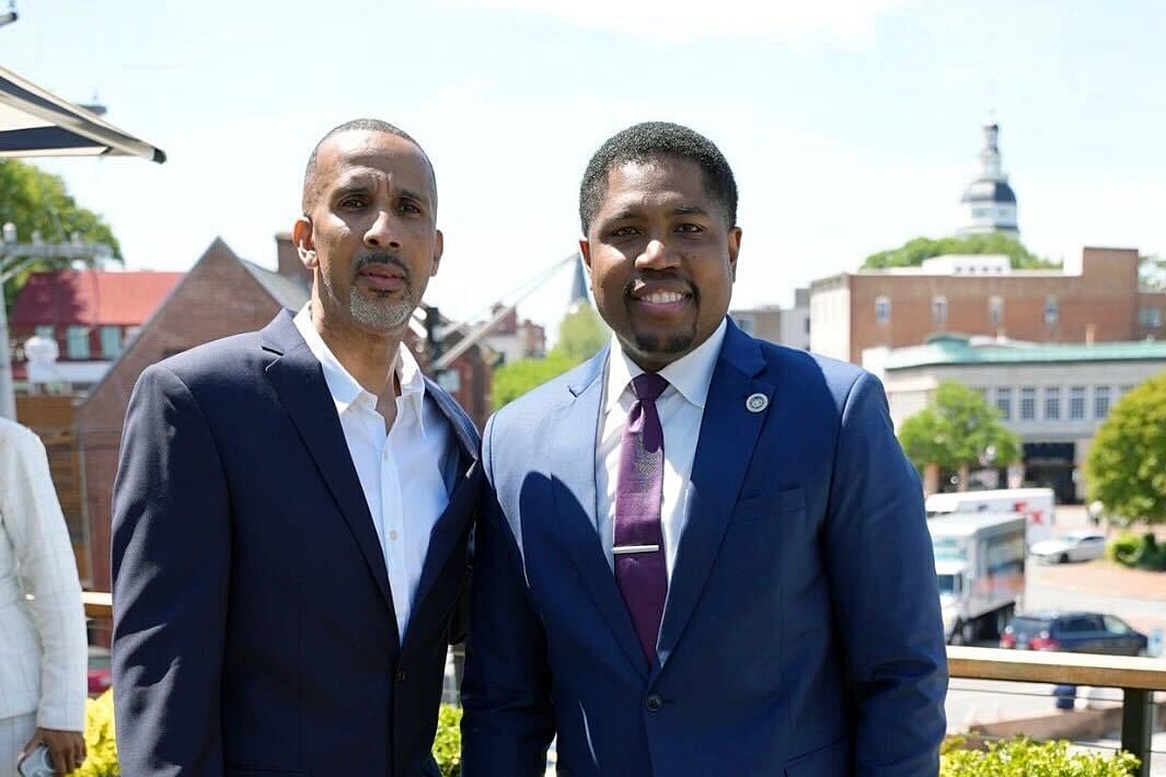 Rapper Mac Phipps, left, and Del. Marlon Amprey, after the signing of Maryland's Protecting Artists’ Creative Expression (PACE) Act on May 12.