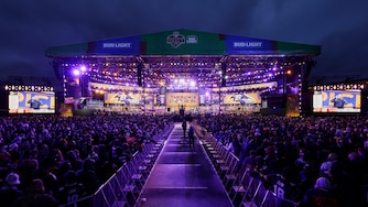 Fans watch during the second round of the NFL football draft, Friday, April 25, 2025, in Green Bay, Wis.