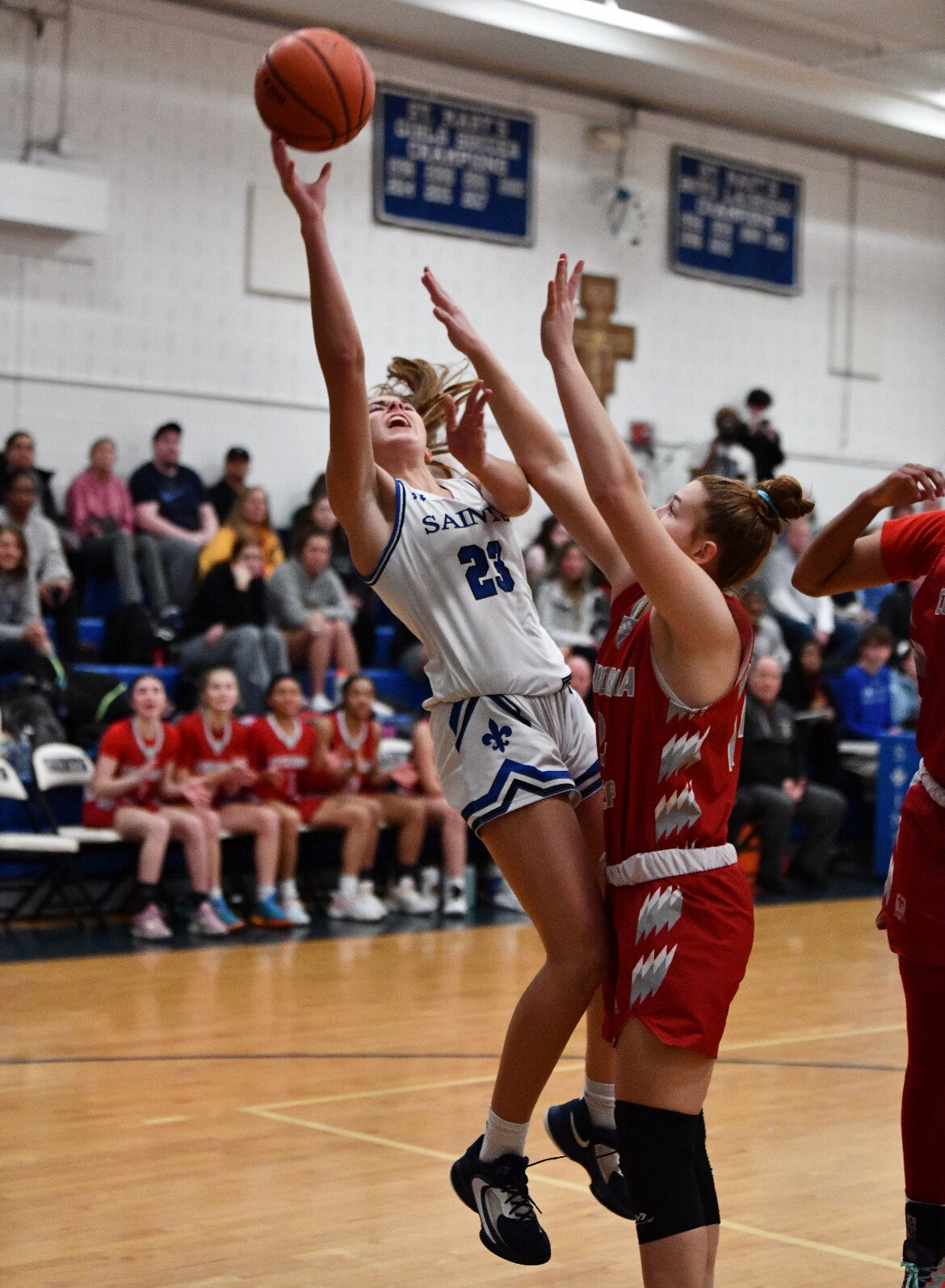 St. Mary's Bailey Harris puts up a shot as Concordia Prep's Hailee Ford defends during Wednesday's IAAM B Conference girls basketball contest. The No. 9 Saints gained sole possession of first place in the IAAM B with a 46-39 victory in Annapolis.