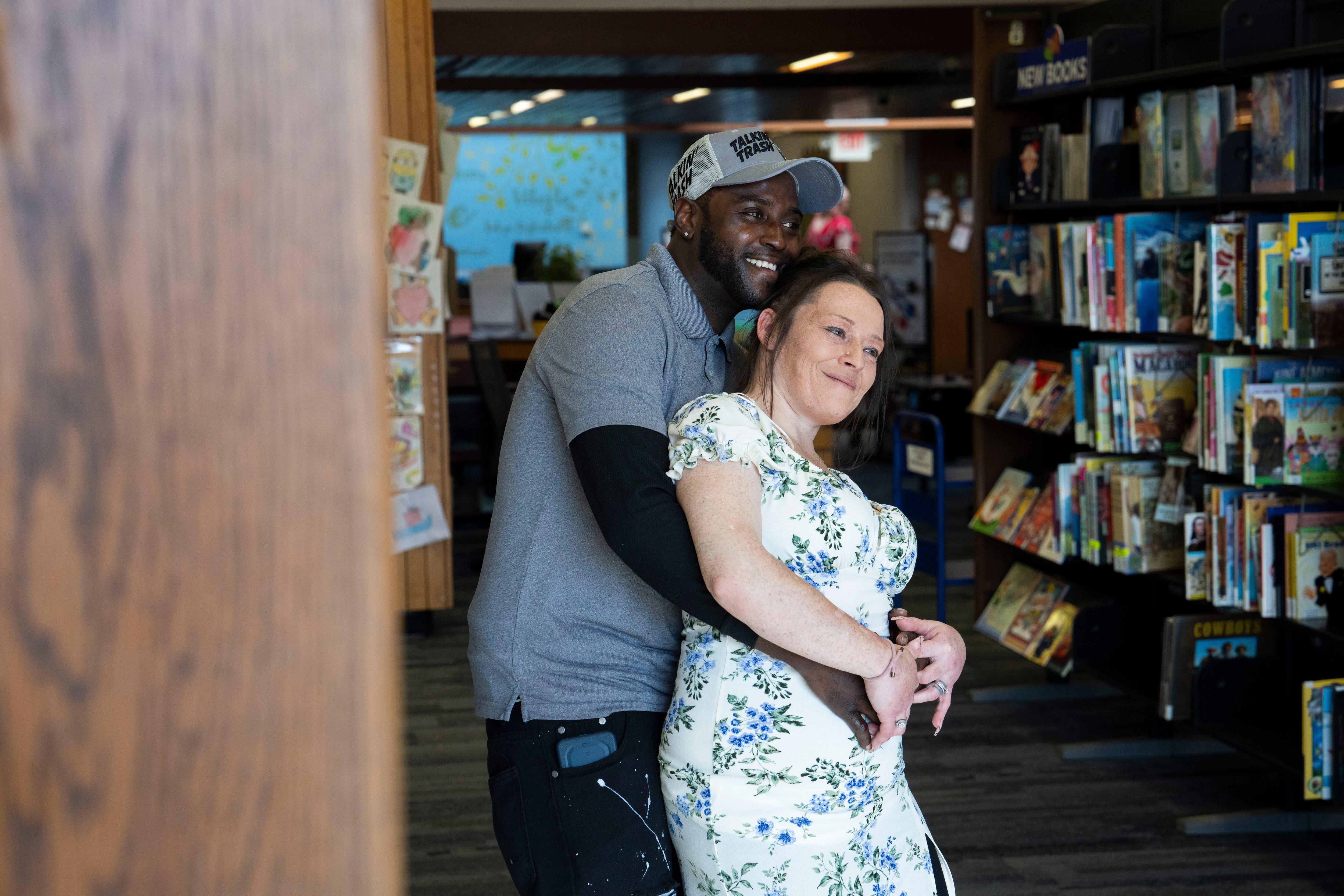 Raymond Hill III and Sheila Petree hug after their wedding ceremony at the Glen Burnie Library.