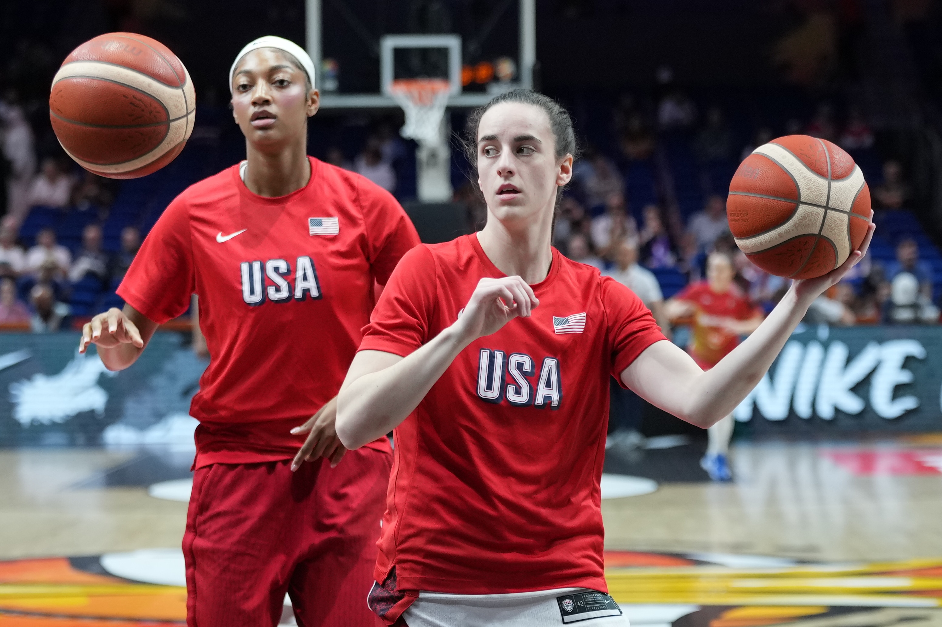 Angel Reese, of the United States, left, and United States' Caitlin Clark warm up for the Women's Basketball World Cup quarterfinal match between the United States and Hungary in Berlin, Thursday, Sept. 10, 2026. (AP Photo/Ebrahim Noroozi)