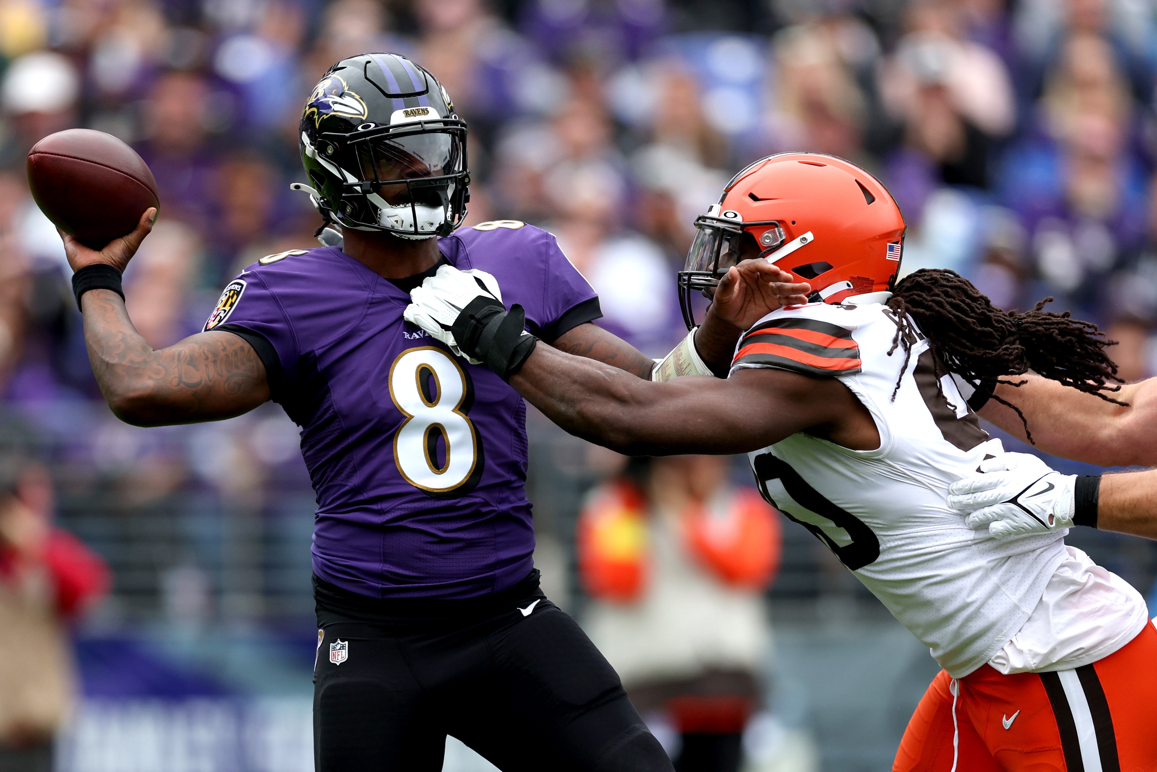 Jadeveon Clowney of the Cleveland Browns pressures Ravens quarterback Lamar Jackson during last season's game in Baltimore.