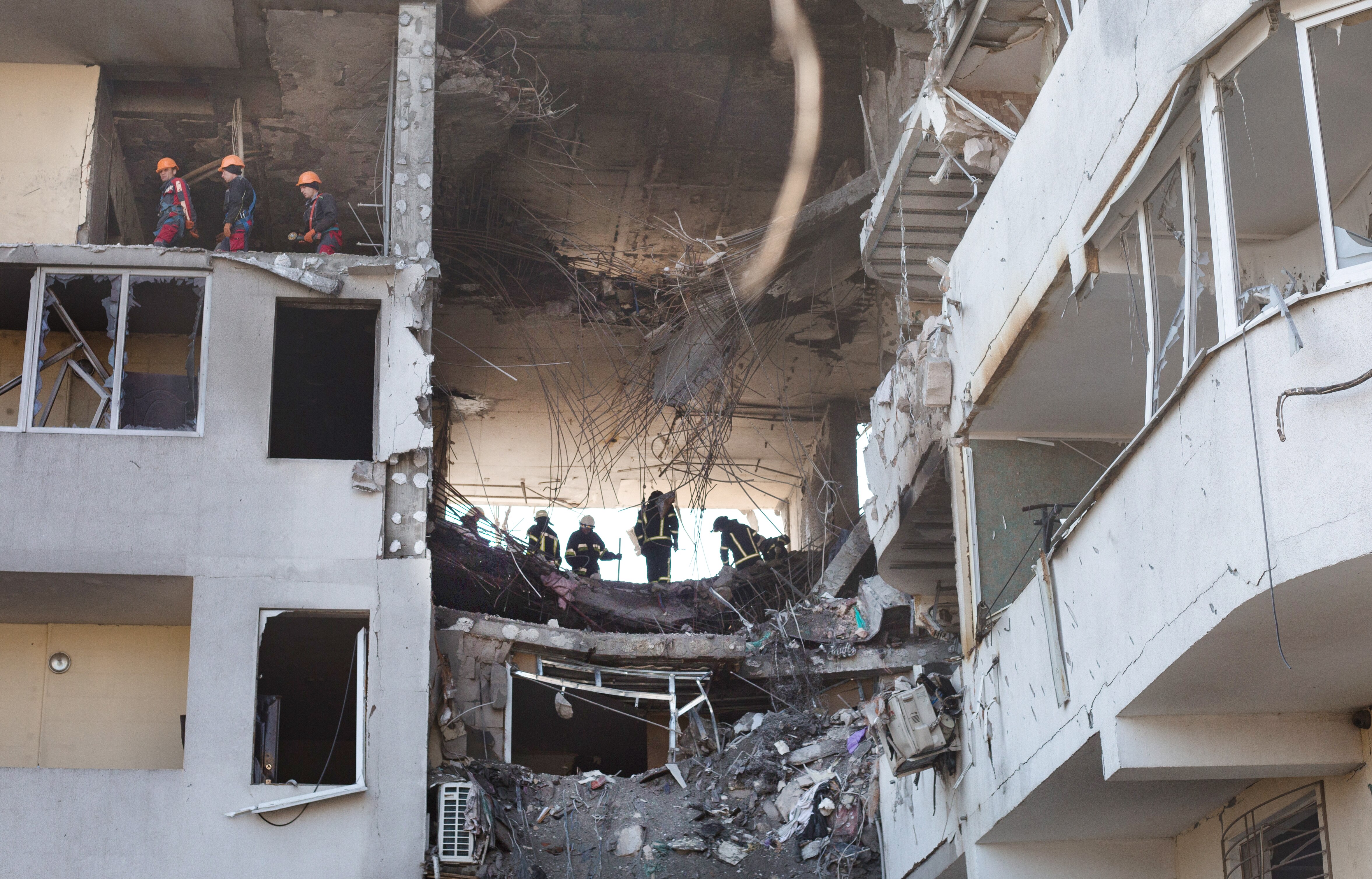 Rescue workers remove rubble from a residential building hit by a rocket in Odesa, Ukraine. Ukrainian forces, as well as civilian Odessans, remain on guard against a potential Russian advance on this historic port city, whose capture could help give Russia control of Ukraine’s southern coast.