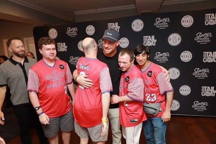 Ryan O'Hearn hugs members of the Newtown Edgmont Angels, a Philadelphia-area Little League Challenger Division team he supports.