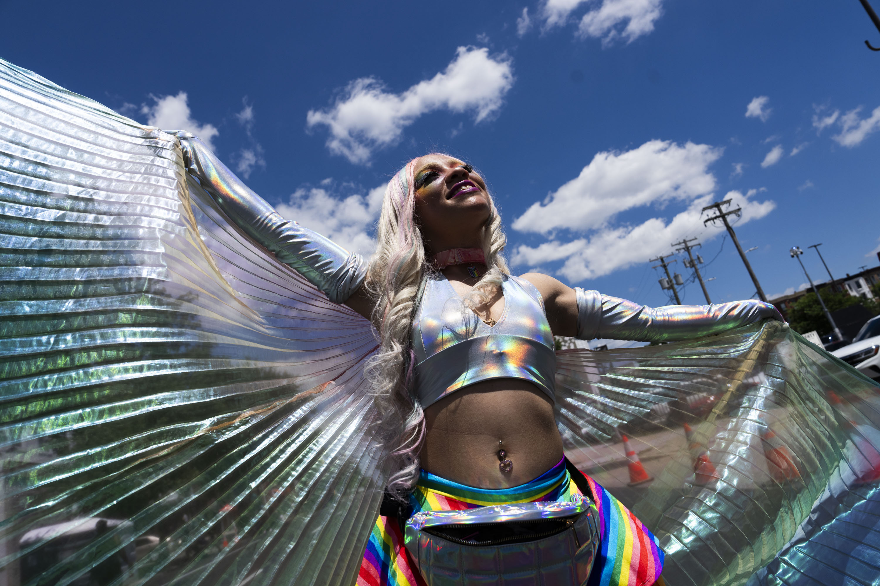 Tysheria Dorsey poses for a portrait with her wings at Baltimore Pride on June 15, 2024.