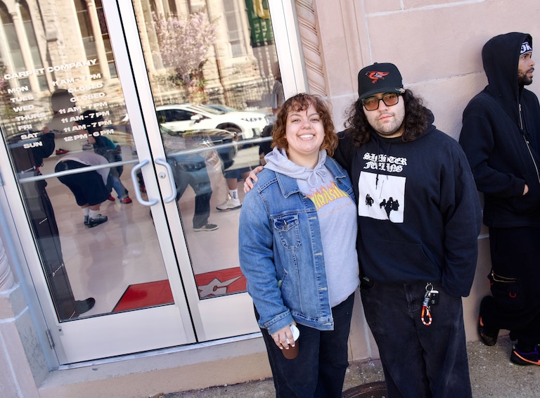 SATURDAY, APRIL 11, 2026 - Zo Salgado (they/them), right, and Sarah Wade (she/her), left, were the first people in line at Carpet Company's flagship store. They arrived around 2:45am from Northern Virginia.