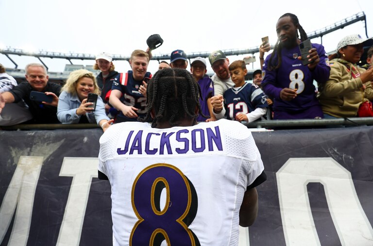FOXBOROUGH, MASSACHUSETTS - SEPTEMBER 25: Quarterback Lamar Jackson #8 of the Baltimore Ravens celebrates with fans after his team's 37-26 win over the New England Patriots at Gillette Stadium on September 25, 2022 in Foxborough, Massachusetts.