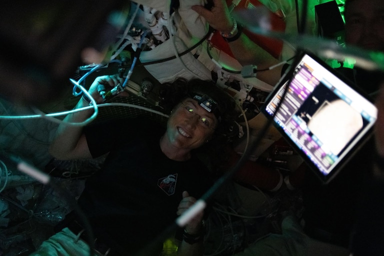 (April 6, 2026) – NASA astronaut and Artemis II Mission Specialist Christina Koch pictured here in the Orion spacecraft during the Artemis II lunar flyby. Koch and her fellow crewmates spent approximately seven hours taking turns at the Orion windows capturing science data to share with their team back on Earth. At closest approach, they came within 4,067 miles of the Moon’s surface.