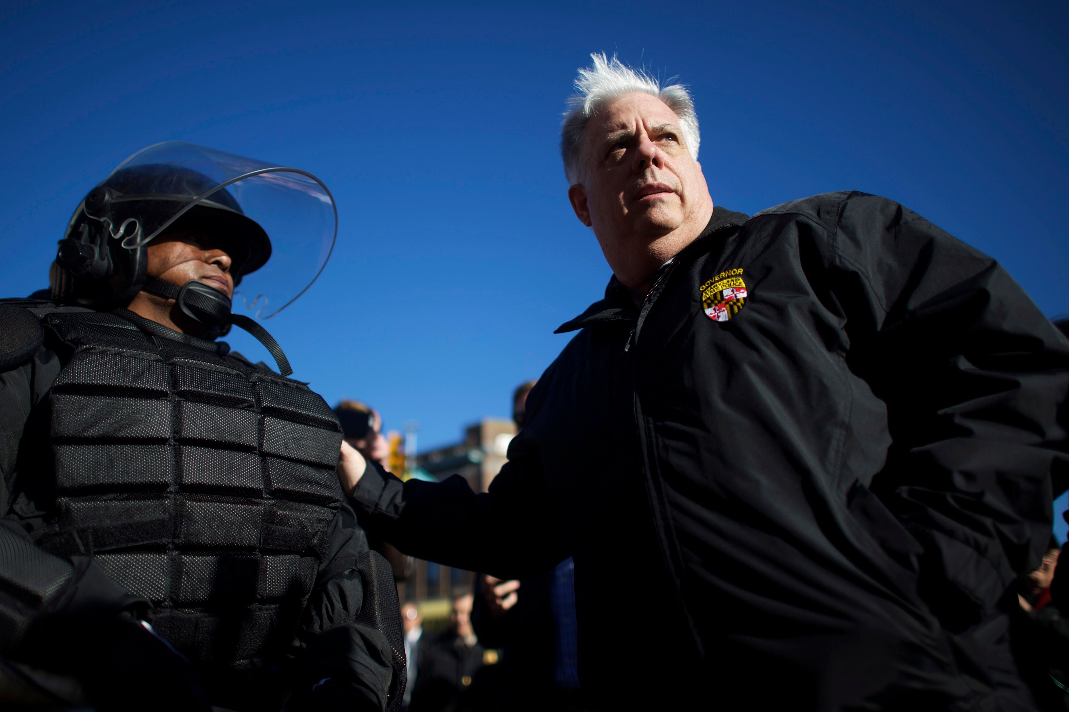 Maryland Gov. Larry Hogan greets Baltimore Police dressed in riot gear the morning after citywide unrest following the funeral of Freddie Gray in Baltimore in 2015 during his first term in office.