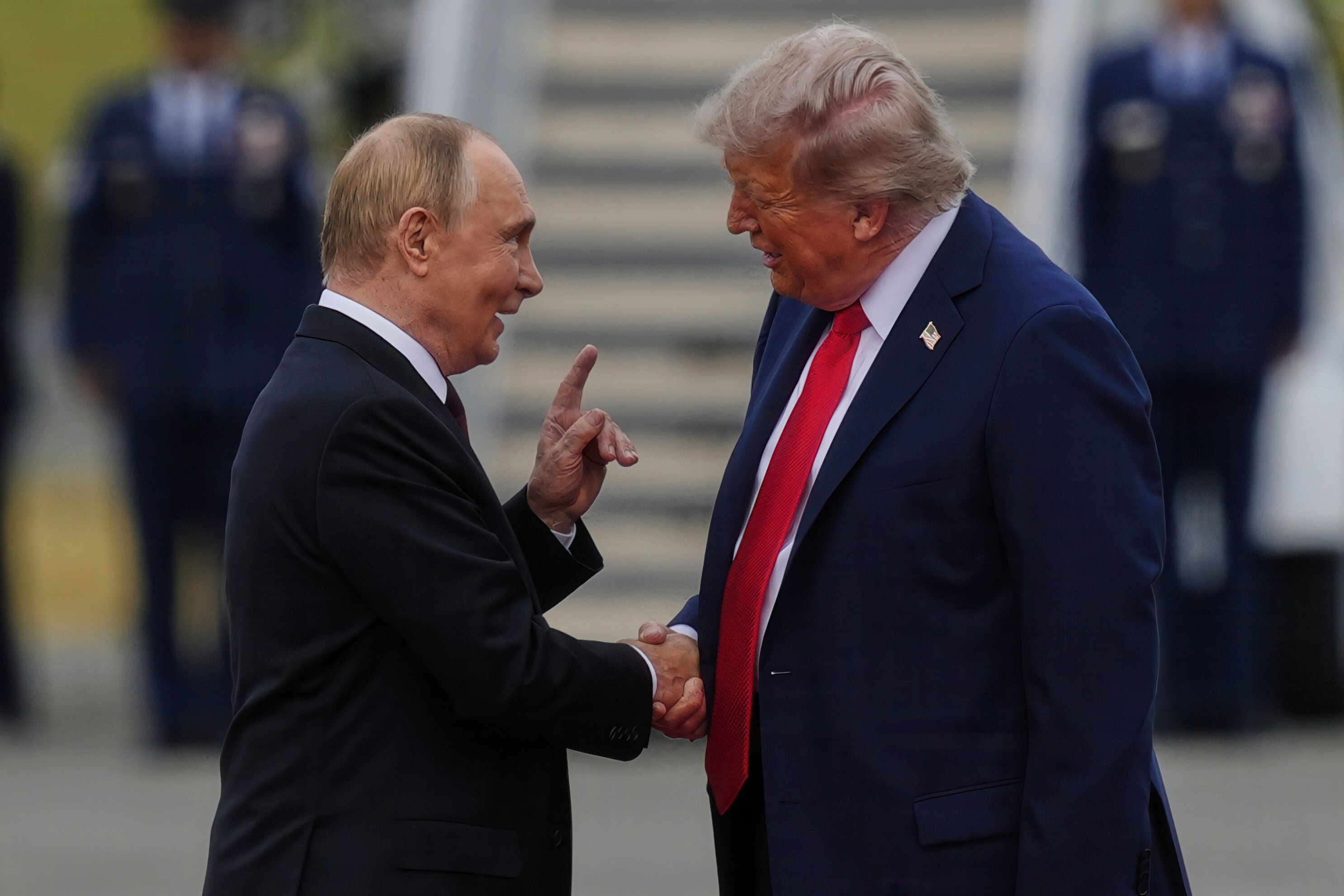 President Donald Trump greets Russia's President Vladimir Putin Friday, Aug. 15, 2025, at Joint Base Elmendorf-Richardson, Alaska. (AP Photo/Julia Demaree Nikhinson)