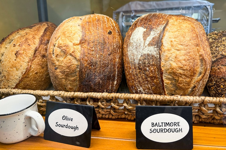 Ovenbird Bakery opened its third location in Baltimore on Friday, June 18, 2025, at Hampden’s Rotunda shopping center.