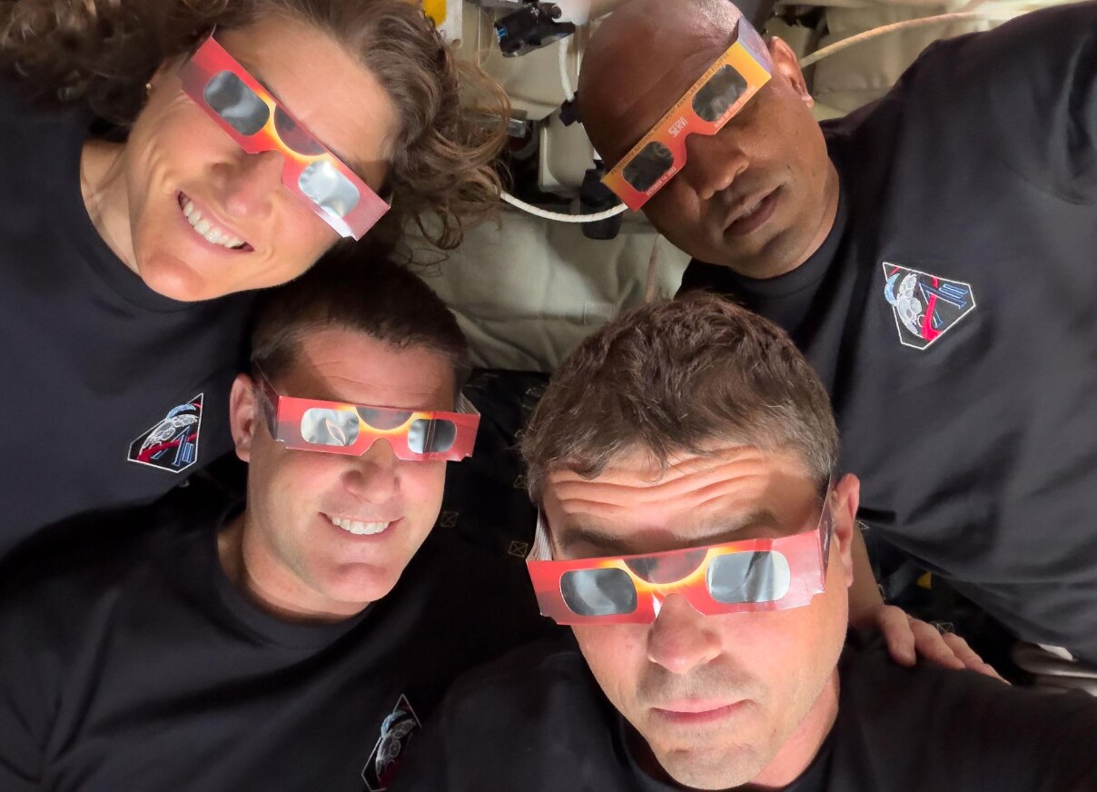 The Artemis II crew – Mission Specialist Christina Koch (top left), Mission Specialist Jeremy Hansen (bottom left), Commander Reid Wiseman (bottom right), and Pilot Victor Glover (top right) – uses eclipse viewers, identical to what NASA produced for the 2023 annular eclipse and 2024 total solar eclipse, to protect their eyes at key moments during the solar eclipse they experienced during their lunar flyby on April 6, 2026. This was the first use of eclipse glasses at the Moon to safely view a solar eclipse.
