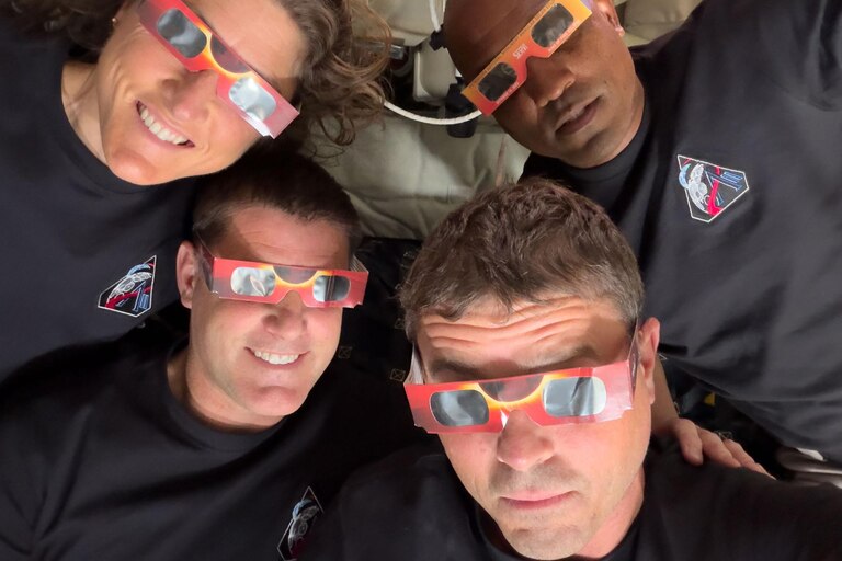 The Artemis II crew – Mission Specialist Christina Koch (top left), Mission Specialist Jeremy Hansen (bottom left), Commander Reid Wiseman (bottom right), and Pilot Victor Glover (top right) – uses eclipse viewers, identical to what NASA produced for the 2023 annular eclipse and 2024 total solar eclipse, to protect their eyes at key moments during the solar eclipse they experienced during their lunar flyby on April 6, 2026. This was the first use of eclipse glasses at the Moon to safely view a solar eclipse.