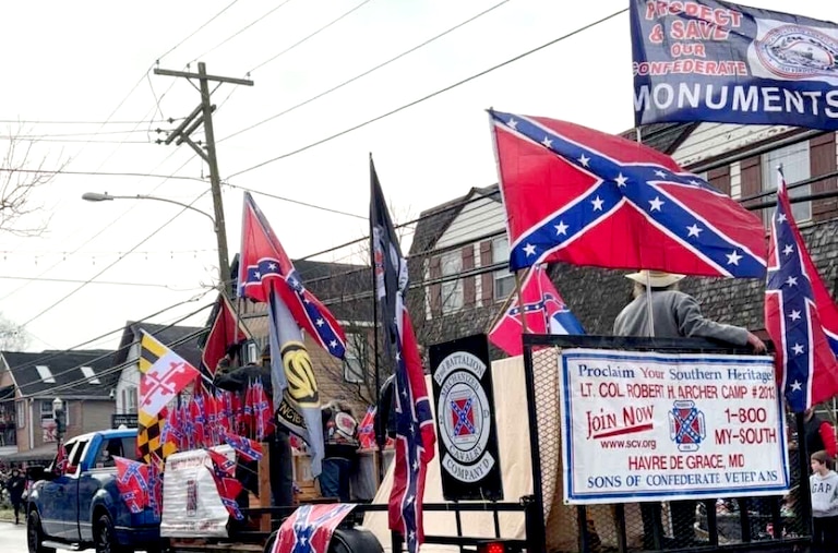Photographs shared anonymously with the racial and social justice group Cecil Solidarity show participants in a Christmas Parade in North East earlier this month carrying confederate flags.