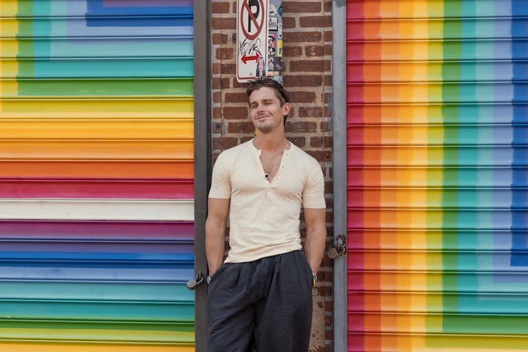 Cooking expert Antoni Porowski poses in front of the LOVE Mural in Blagden Alley in DC.