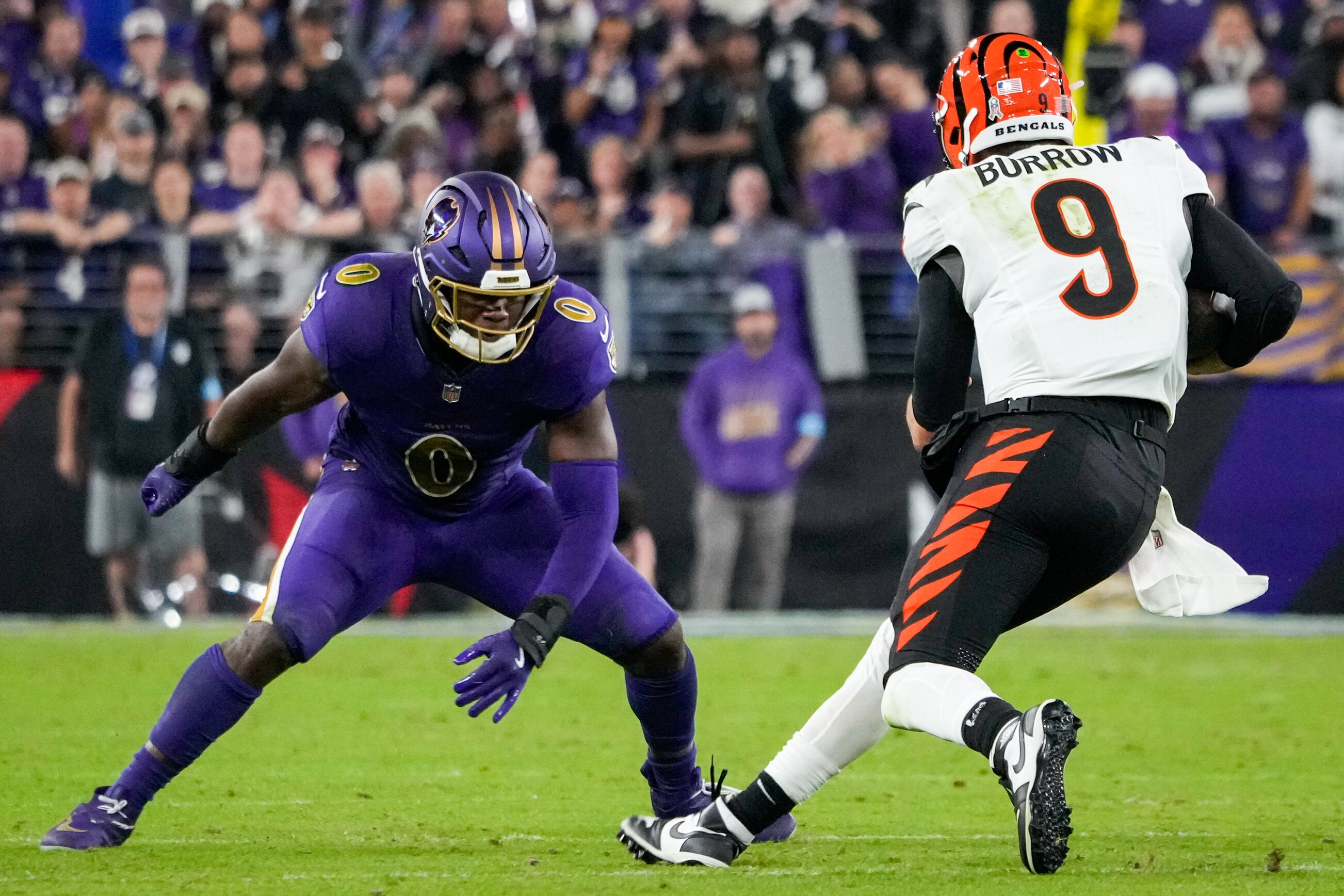 Baltimore Ravens linebacker Roquan Smith (0) stops Cincinnati Bengals quarterback Joe Burrow (9) from advancing during a Thursday Night Football game at M&T Bank Stadium in Baltimore, Md., November 7, 2024.