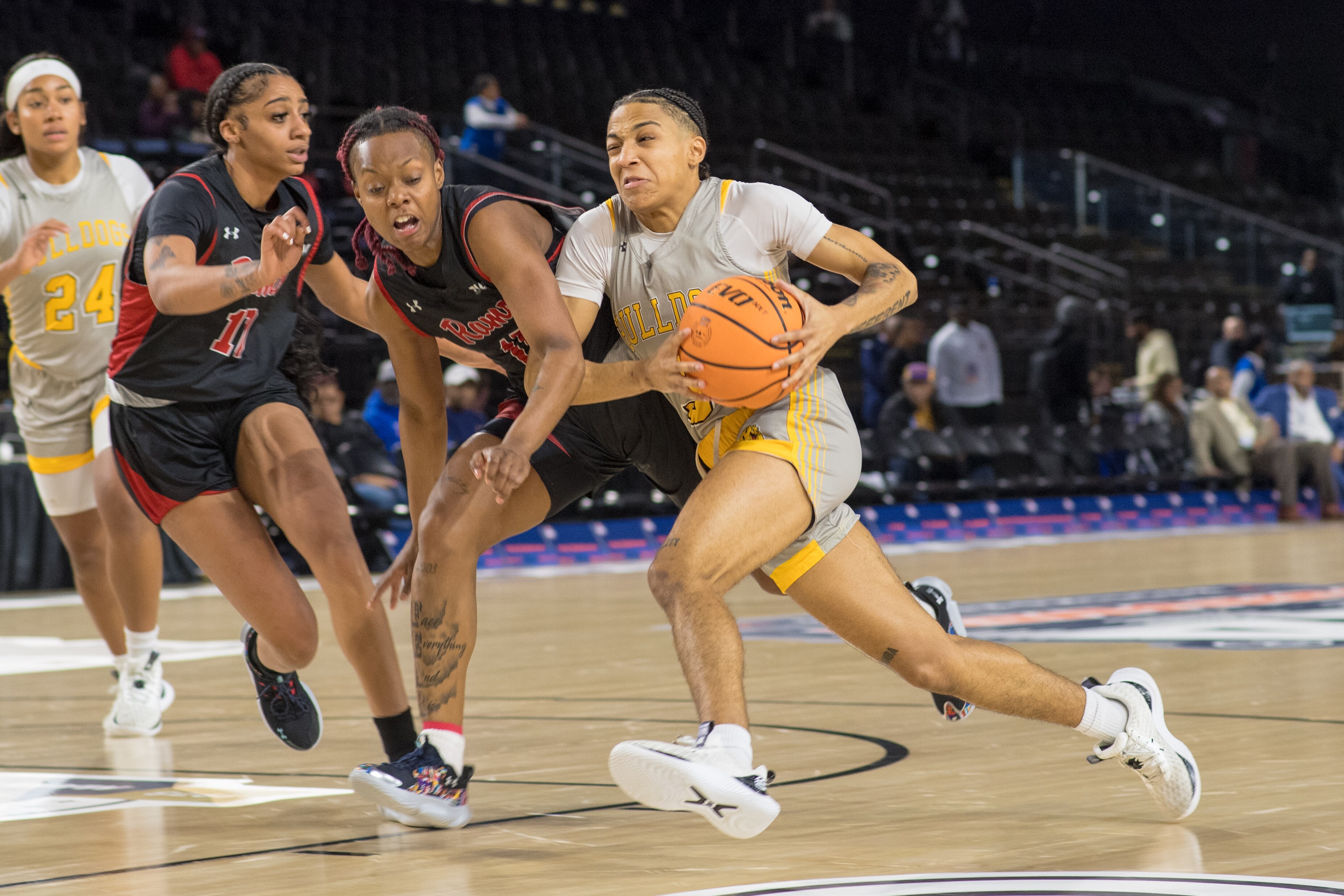A Bowie State player drives against Winston-Salem State in the opening game of the 2024 CIAA tournament in Baltimore. (Photo courtesy of CIAA)