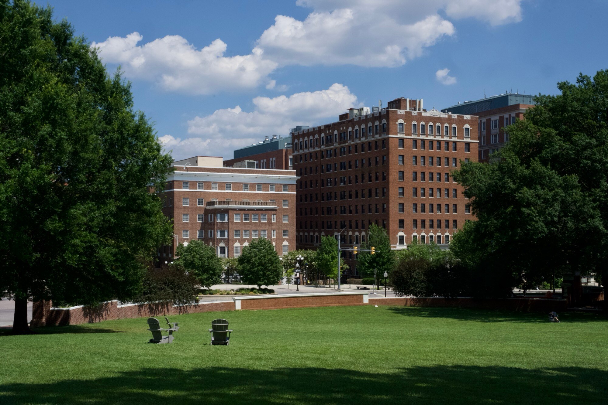 Empty lounge chairs sit on the quad at Johns Hopkins University on July 3, 2025.