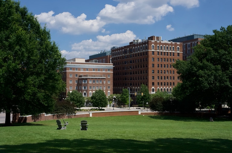 Empty lounge chairs sit on the quad at Johns Hopkins University on July 3, 2025.