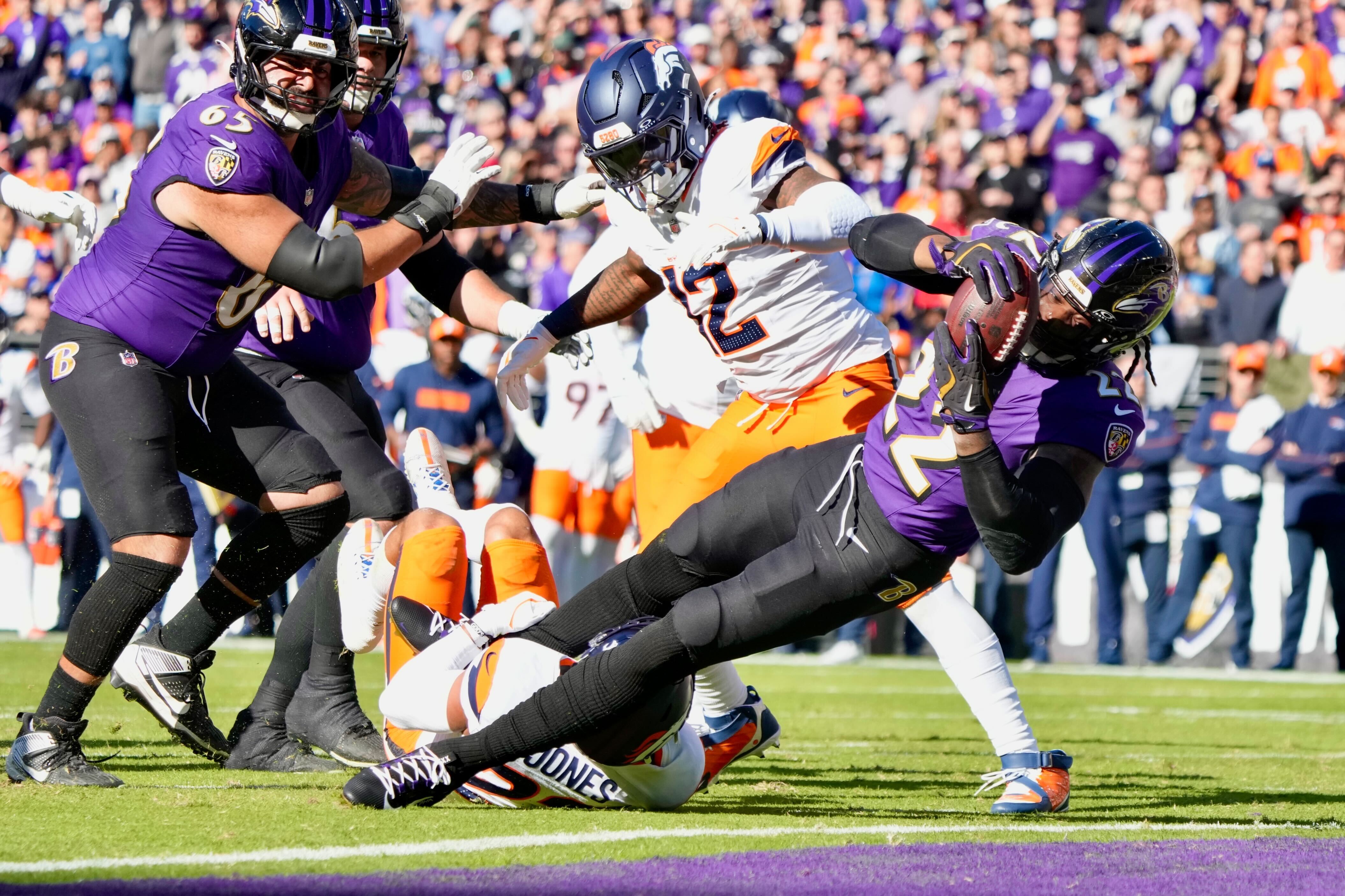Derrick Henry (RB 22) scores a touchdown in the first quarter of a regular season game against the Denver Broncos at M&T Bank Stadium on Sunday, November 3, 2024. It was his 100th career rush touchdown.