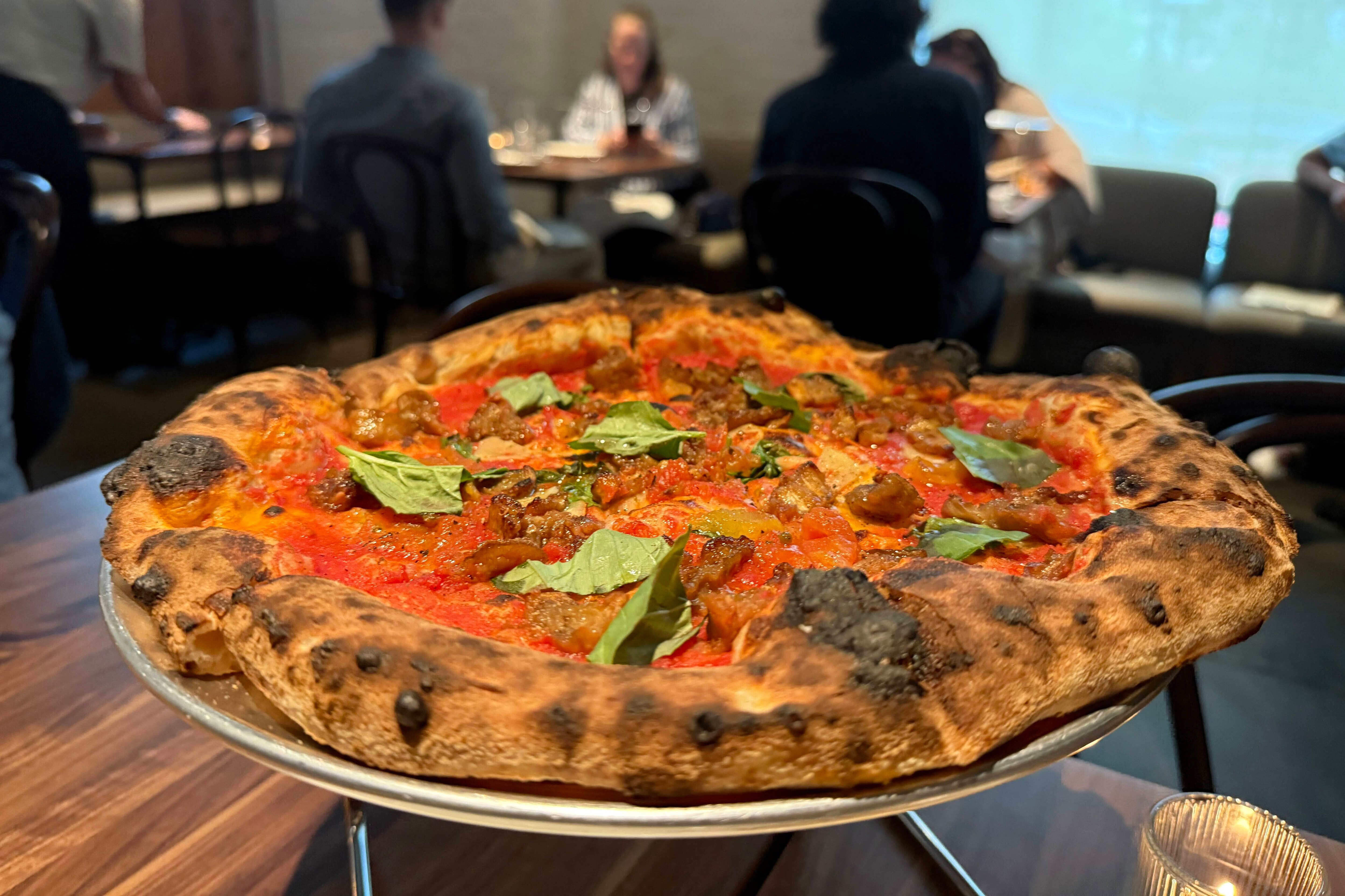 Flour and Wood's specialty is Neapolitan-style pizza. The menu also features a range of vibrant Italian-influenced specialties like panzanella salad, gamberone al forno, and crispy mushrooms with punchy fermented jalapeno.