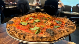 Flour and Wood's specialty is Neapolitan-style pizza. The menu also features a range of vibrant Italian-influenced specialties like panzanella salad, gamberone al forno, and crispy mushrooms with punchy fermented jalapeno.