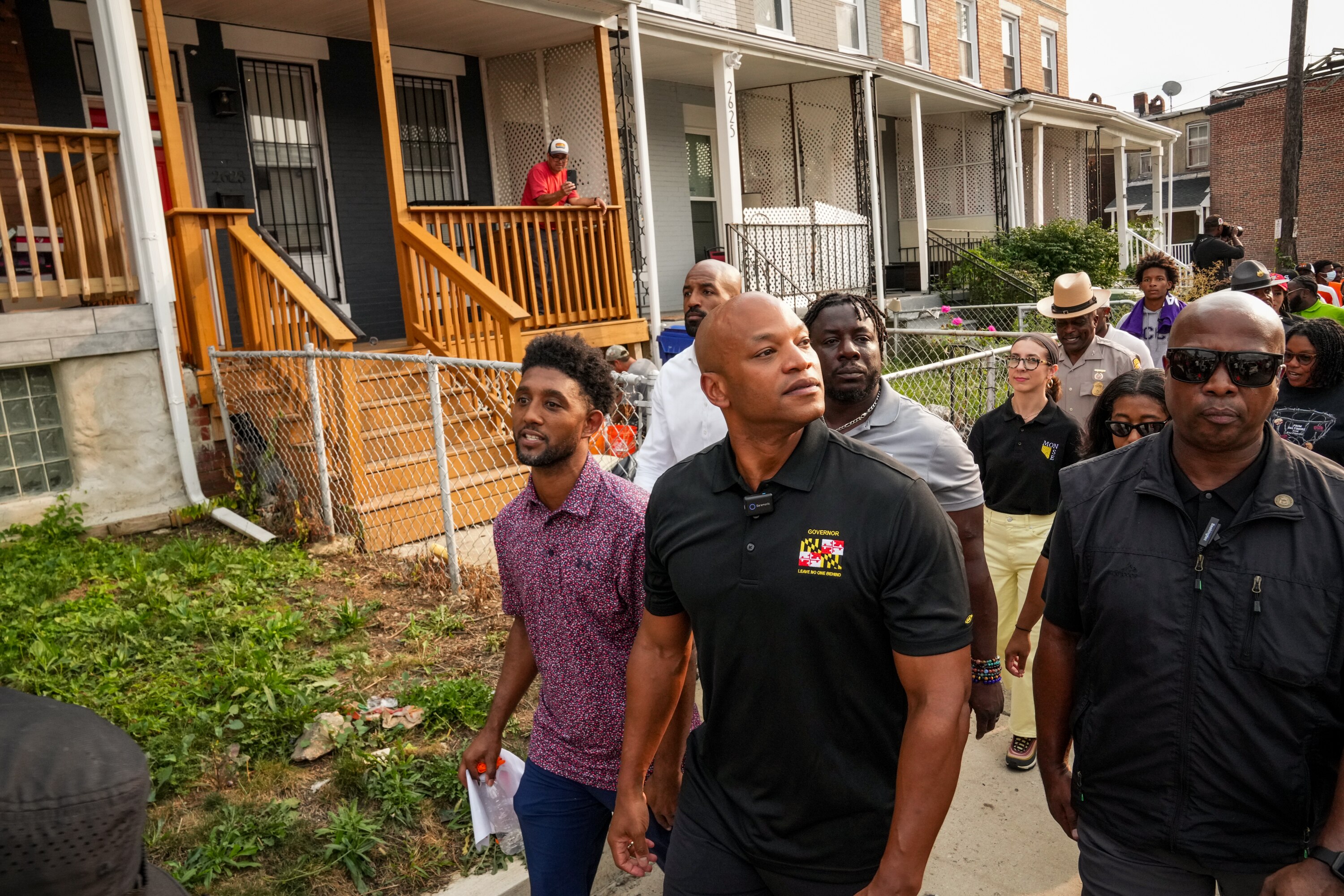 Gov. Wes Moore and Mayor Brandon Scott lead a community walk with elected officials and law enforcement in Northwest Baltimore on Friday.