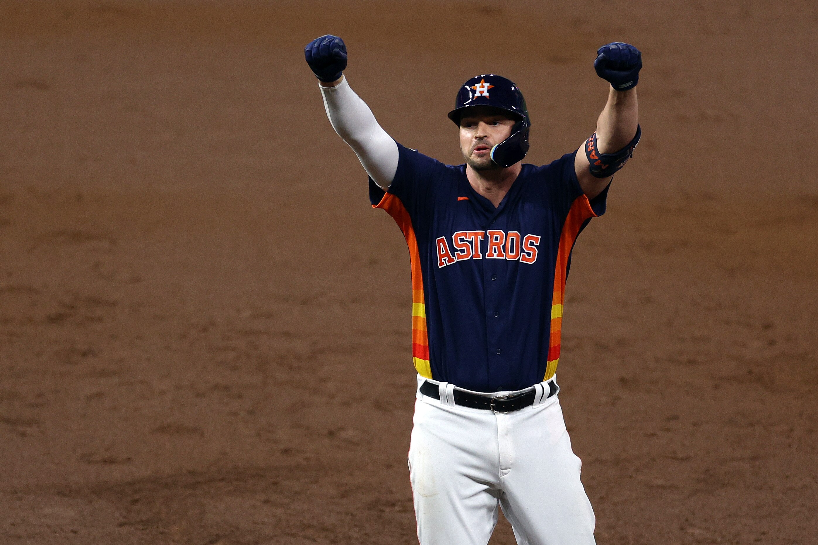 HOUSTON, TEXAS - NOVEMBER 05: Trey Mancini #26 of the Houston Astros reacts after hitting a single against the Philadelphia Phillies during the third inning in Game Six of the 2022 World Series at Minute Maid Park on November 05, 2022 in Houston, Texas.