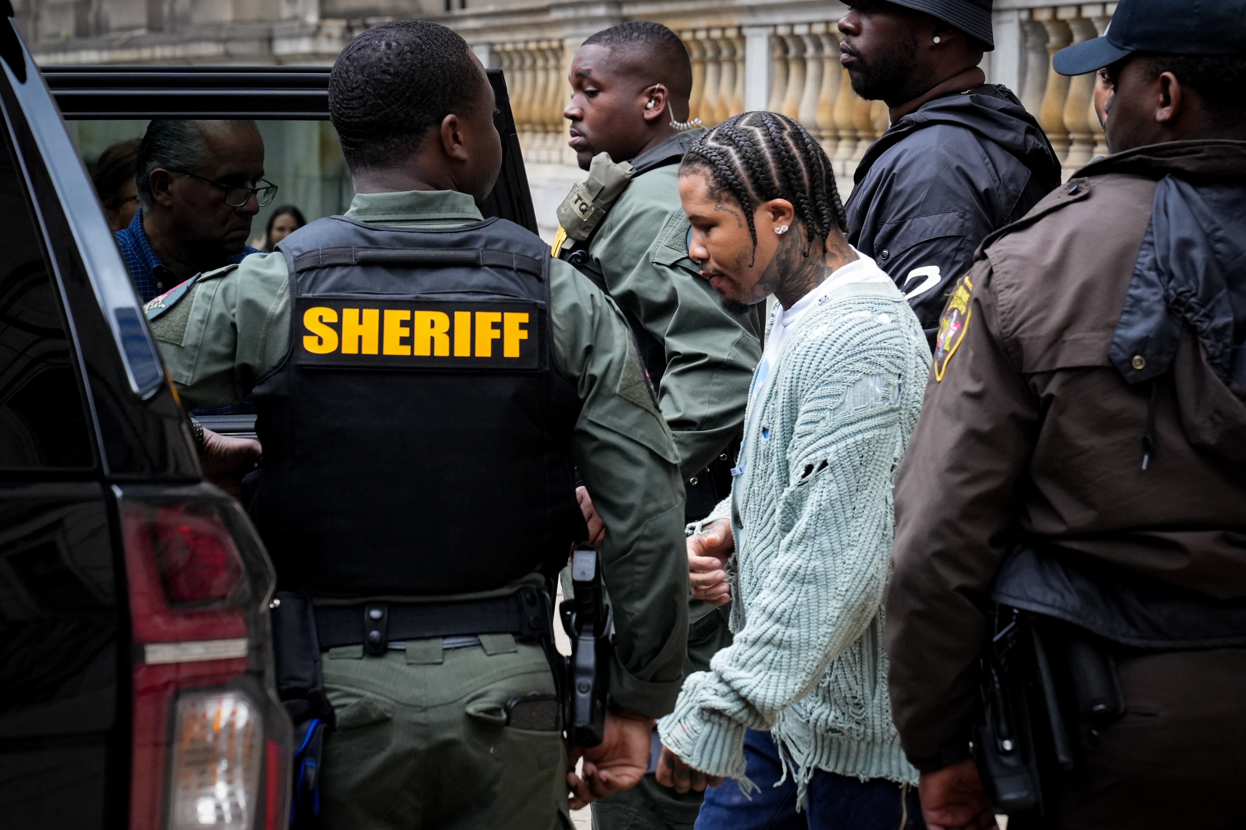 Baltimore boxing champion Gervonta “Tank” Davis returns to his vehicle after being sentenced to 90 days of home detention, and three years of probation, by a judge at the Elijah E. Cummings Courthouse on Friday, May 5. Davis pleaded guilty to four traffic offenses in connection to a hit-and-run in 2020 that injured four people.