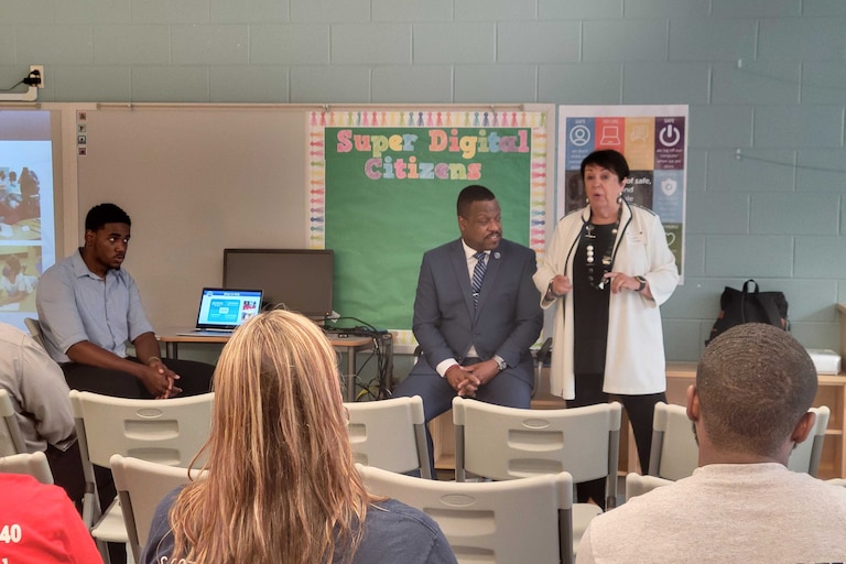 Superintendent Darryl Williams, left, and Deborah Phelps, executive director of The Education Foundation of Baltimore County Public Schools, addresses an audience at the system's first Partnership Fair on Wednesday.