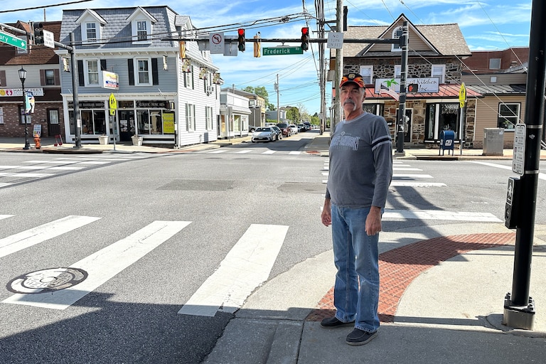 Bill Trentler poses on Frederick Road in Catonsville along the route where he delivered packages for over two decades. He retired from UPS on April 24.