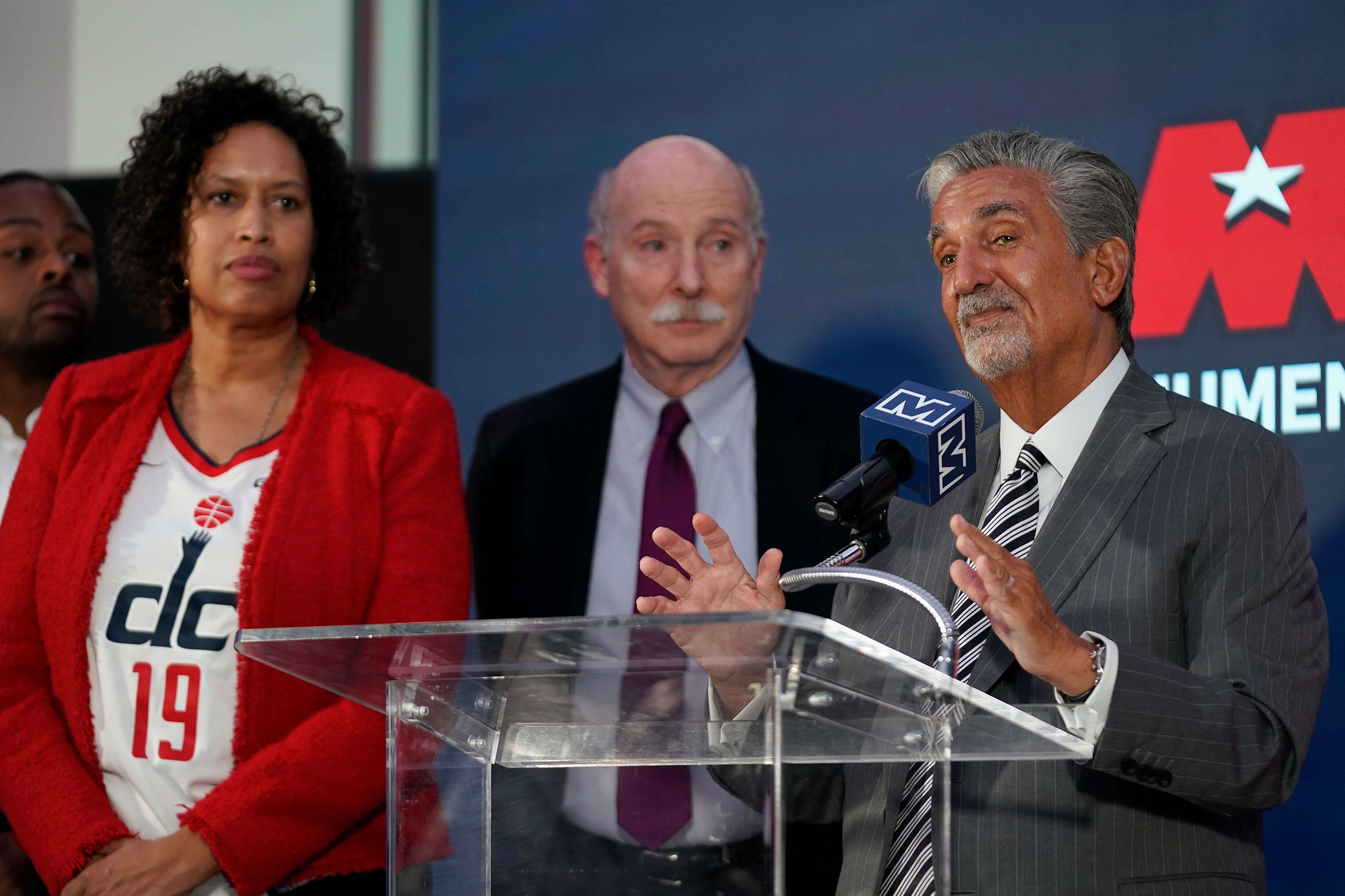 Ted Leonsis (right), owner of the Washington Wizards and Washington Capitals, speaks during a news conference with D.C. Mayor Muriel Bowser (left) and Council Chairman Phil Mendelson on Wednesday.
