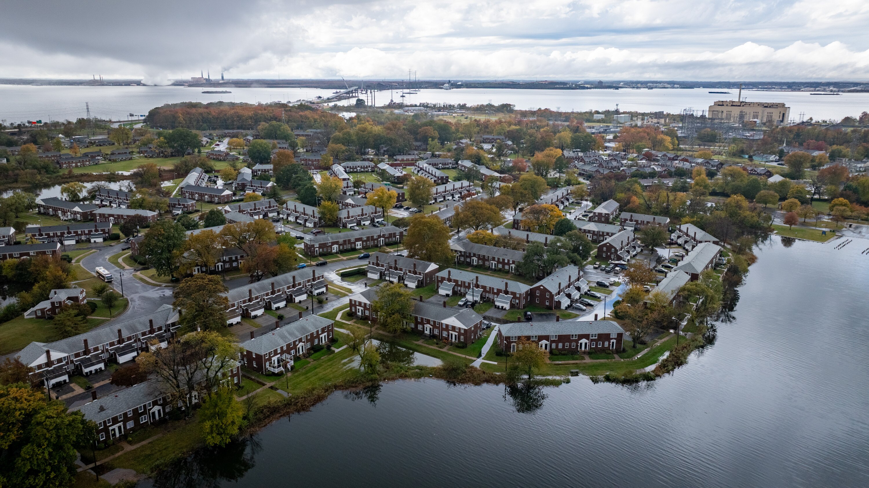 Wednesday, Oct. 29, 2025 — The Day Village Townhomes are seen along Bear Creek in the Turner Station community following a rainstorm and coastal flood advisory.