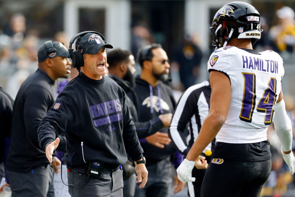 Head coach John Harbaugh of the Baltimore Ravens talks to Kyle Hamilton #14 in the second quarter of a game at Acrisure Stadium on November 17, 2024, in Pittsburgh, Pennsylvania.