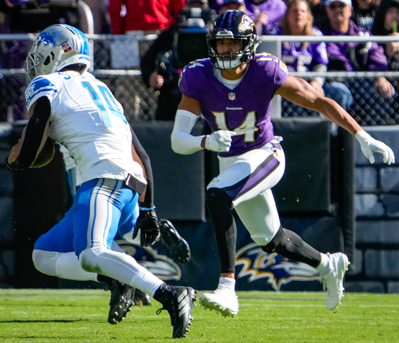 Baltimore Ravens safety Kyle Hamilton (14) runs after Detroit Lions wide receiver Amon-Ra St. Brown (14) during the second quarter against the Detroit Lions at M&T Bank Stadium on Sunday, Oct. 22, 2023.
